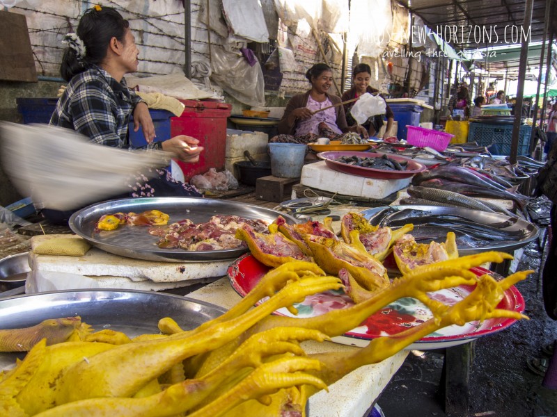 The local food market in Myawaddy offers plenty while the flies are chased off with plastic bags on a stick ...